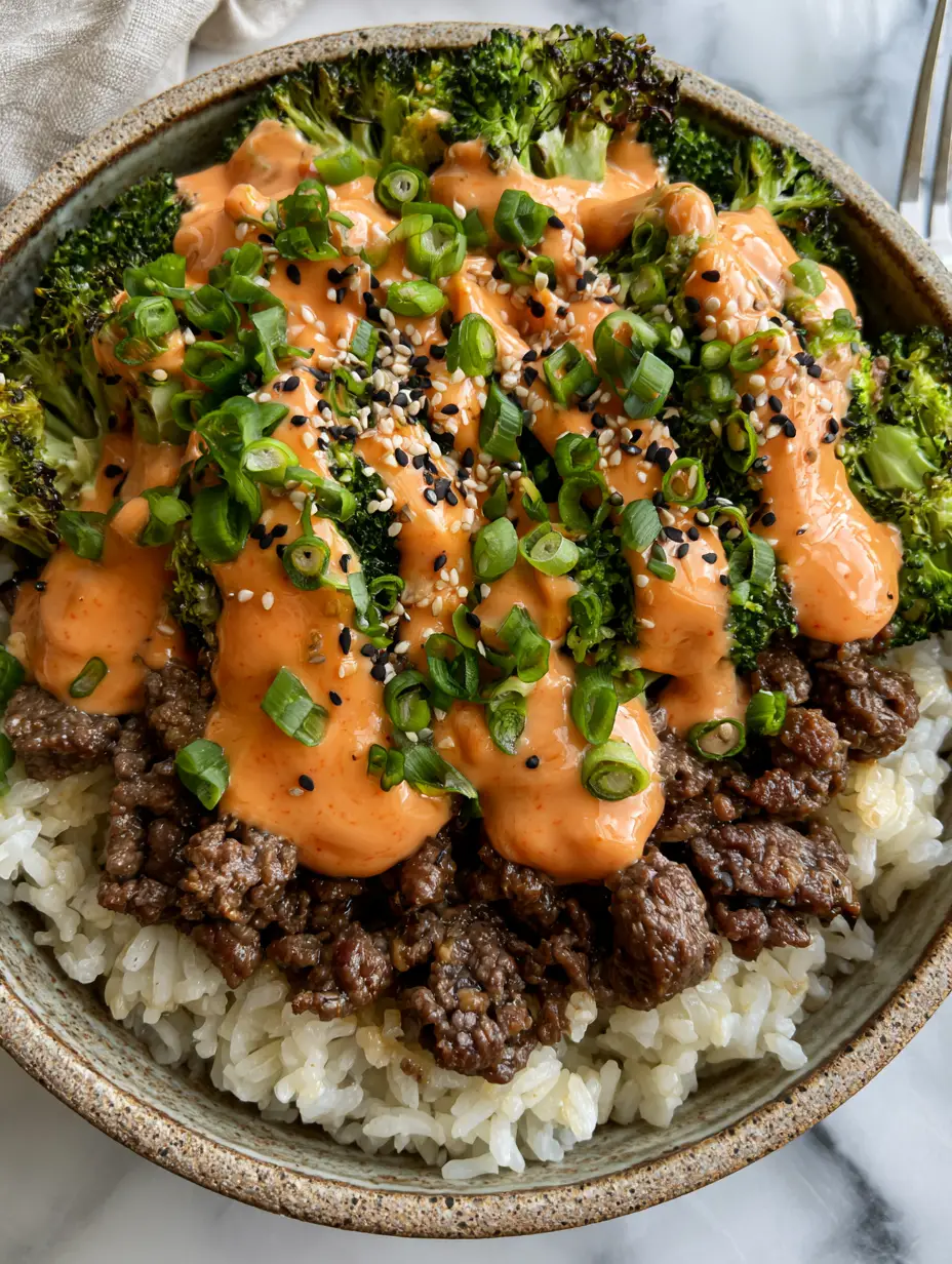 Beef and Broccoli Bowls with Creamy Sriracha Mayo and Jasmine Rice 3 Gourmet ground beef and broccoli rice bowl with vibrant green charred broccoli and glistening beef crumbles. (beef and broccoli bowls)