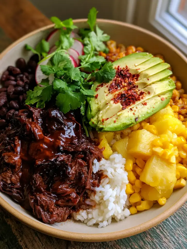 Chipotle Pineapple Beef Bowls with Glazed Shredded Steak and Avocado 1 Overhead shot showing the vibrant colors of corn, beans, and pineapple in chipotle pineapple beef bowls.